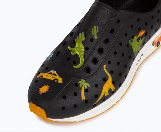 Black shoe with colorful dinosaur and taxi design on a white background