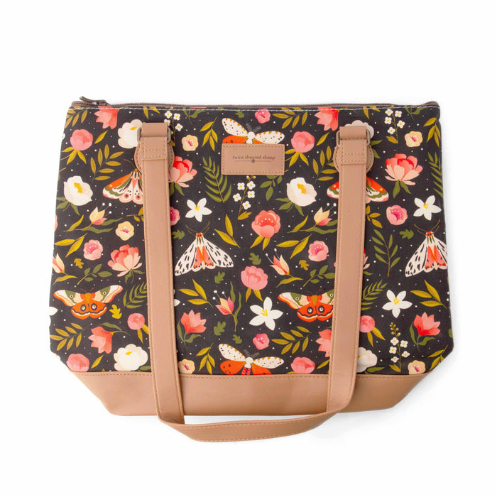 Night Forest Mega Trinity Bag front view with handles upright showing the dark floral and moth print cotton canvas with Twice Sheared Sheep label, tan vegan leather bottom, and top zipper