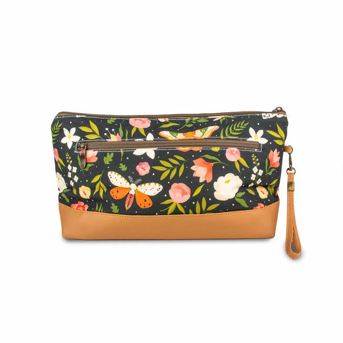 Back view of Night Forest Trinity Bag showing the exterior zipper pocket with dark navy moth and floral print and tan faux leather bottom