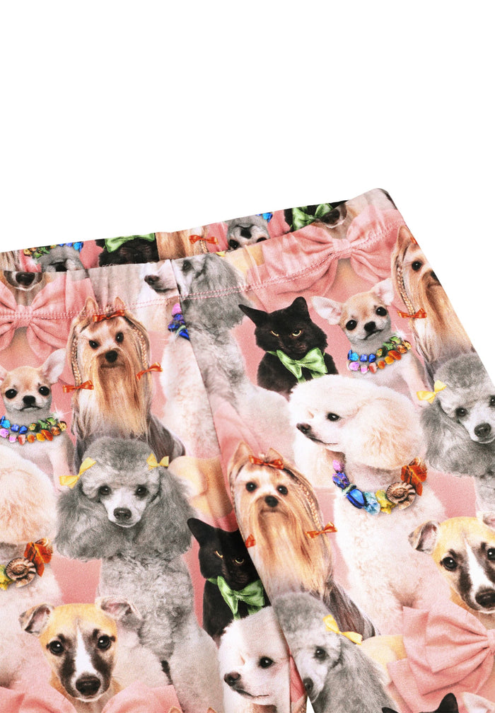 Patterned fabric with images of dogs and bows on a white background
