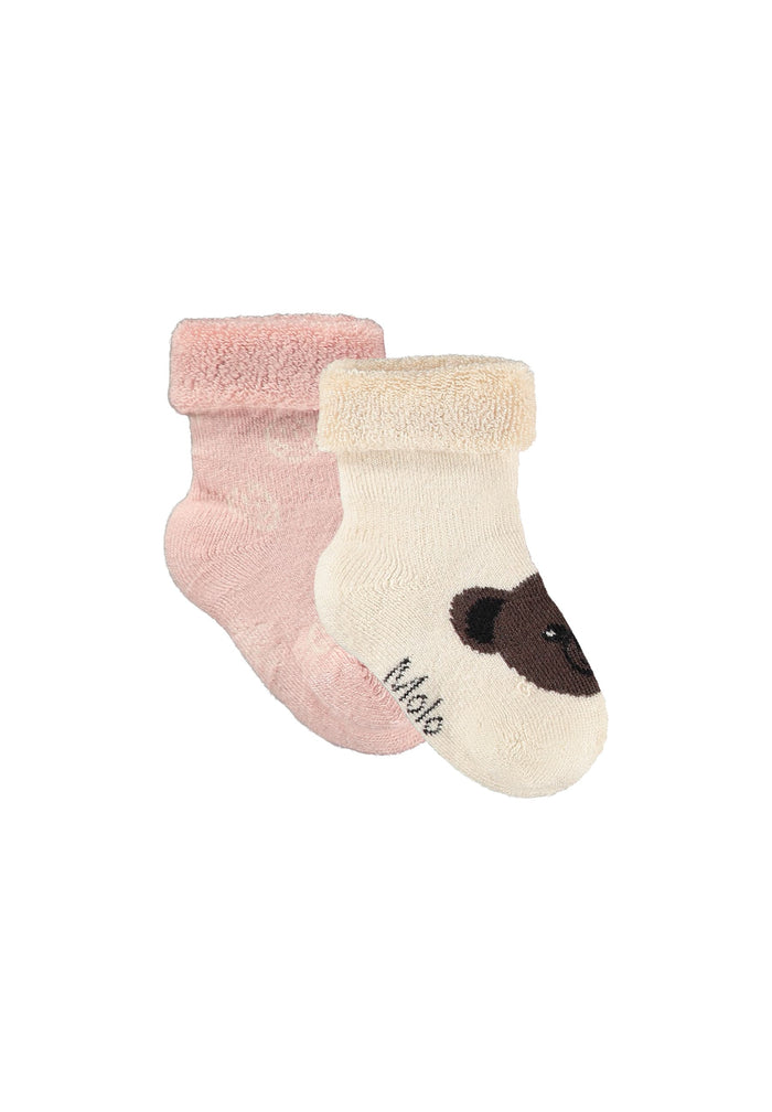 Two baby socks, one pink and one beige with a brown bear design, on a white background.