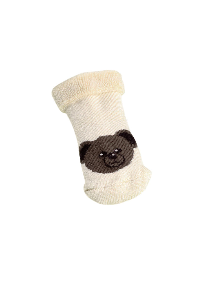 Baby sock with a bear face design on a white background