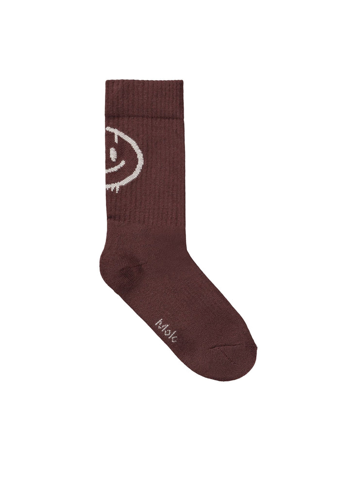 Burgundy sock with smiley on a white background