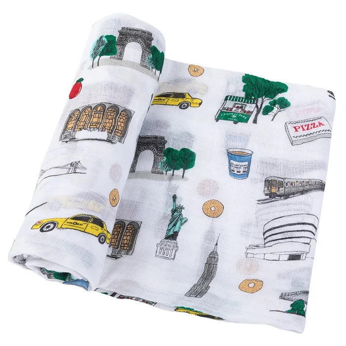 Folded fabric with New York City-themed illustrations on a white background