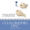 Ocean Buddies Duo pattern cover showing two cream knitted toys — a round puffer fish with blue bubble accents above and an elongated whale below — with wave border and title Whale Buddy & Puffer Fish by Dawn Prickett