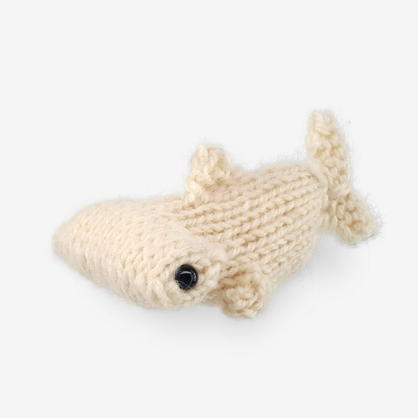 Small knitted cream stingray toy with black bead eyes from Ocean Buddies pattern collection