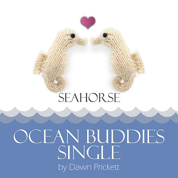 Two cream knitted seahorse toys facing each other with pink heart above ocean wave border
