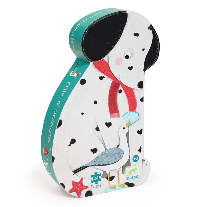 Puzzle packaging shaped like a dalmatian dog with a red scarf and bird, on a white background.