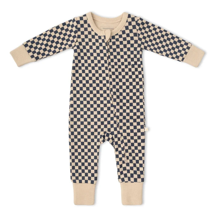 zip down baby one-piece in beige and navy blue check pattern on white background