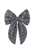 Blue bow with floral heart pattern on a white background