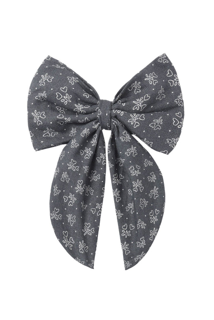 Blue bow with floral heart pattern on a white background