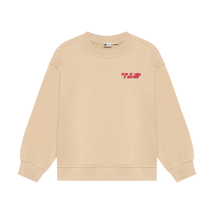 Beige crewneck sweatshirt with red "flip it like a record" embroidered on upper left side on white background,