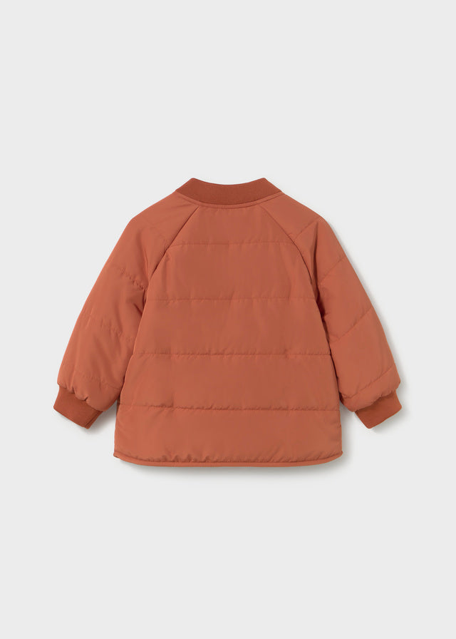 Brown puffer jacket on a light gray background