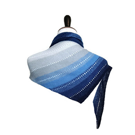 Pathway scarf in gradient blue and white wrapped around a mannequin neck showing the diagonal stripe pattern and triangular shawl shape