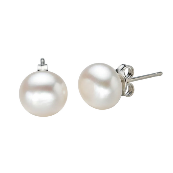 Pair of white button-shaped pearl earrings with a silky luster and silver-tone post backings, shot against a clean white backdrop with soft professional lighting.