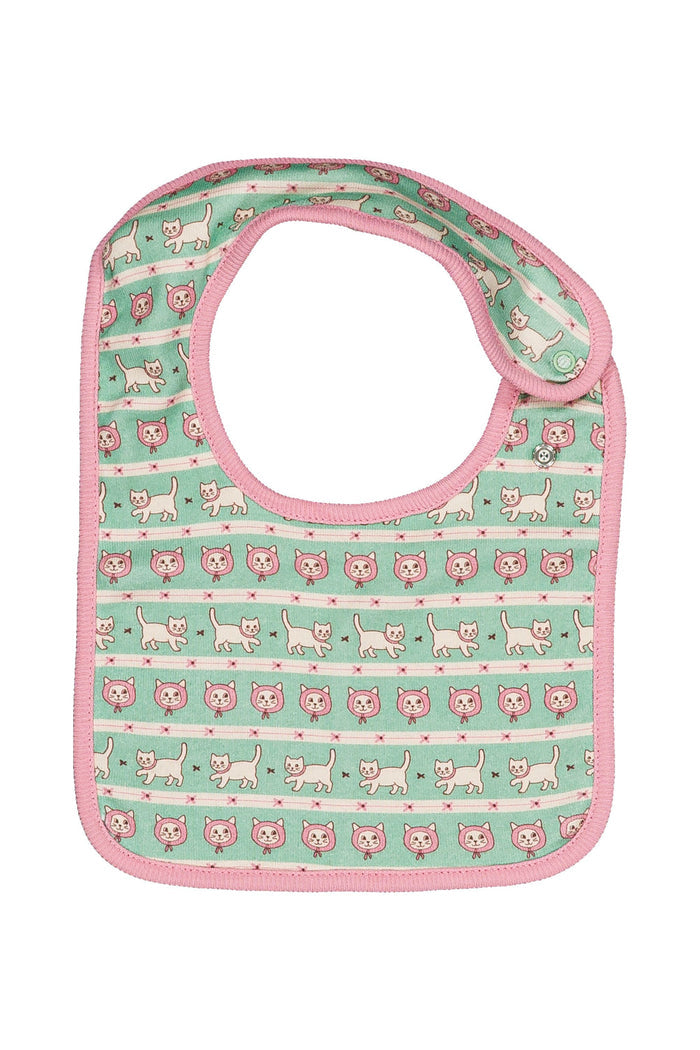 A baby bib with a mint green background patterned with pink and white cats, finished with a pink border and strap.