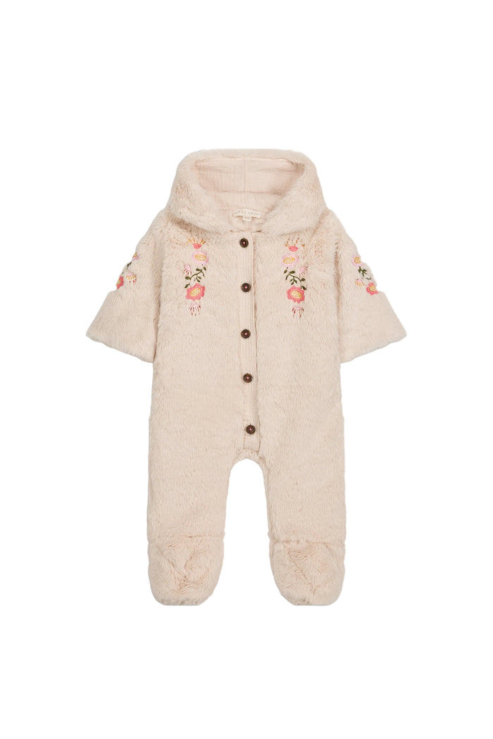 faux fur cream baby footed romper with hood and brown button. pink and green delicate floral embroidering on chest and arms. white background.