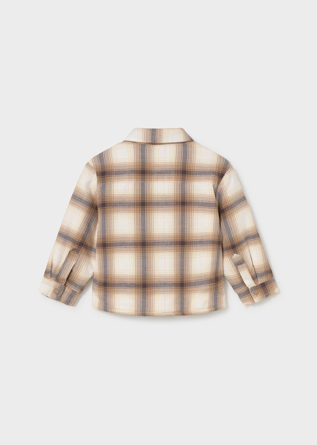 Plaid shirt on a light gray background