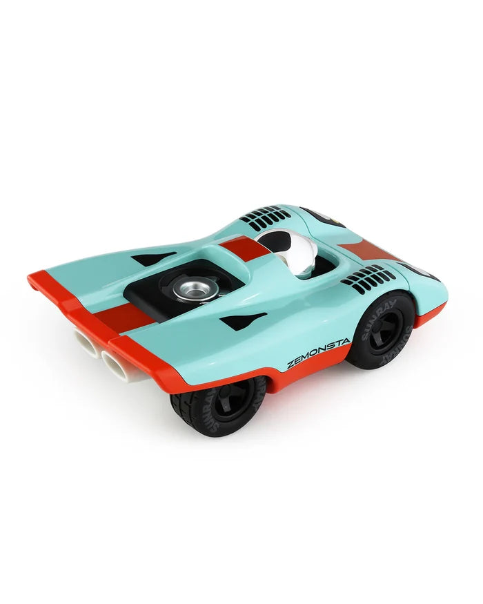 Toy car with a turquoise body and red accents on a white background