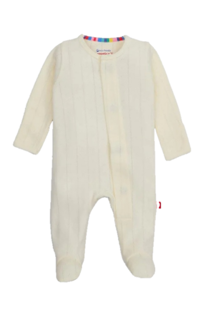 An off-white ribbed knit baby footed sleeper with long sleeves and a button-up front, shown against a plain white background.