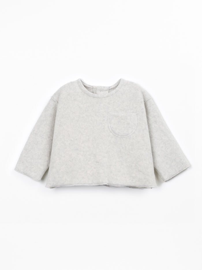 A light gray heathered long-sleeve sweatshirt with a single patch pocket on the left chest, displayed flat against a clean white background.