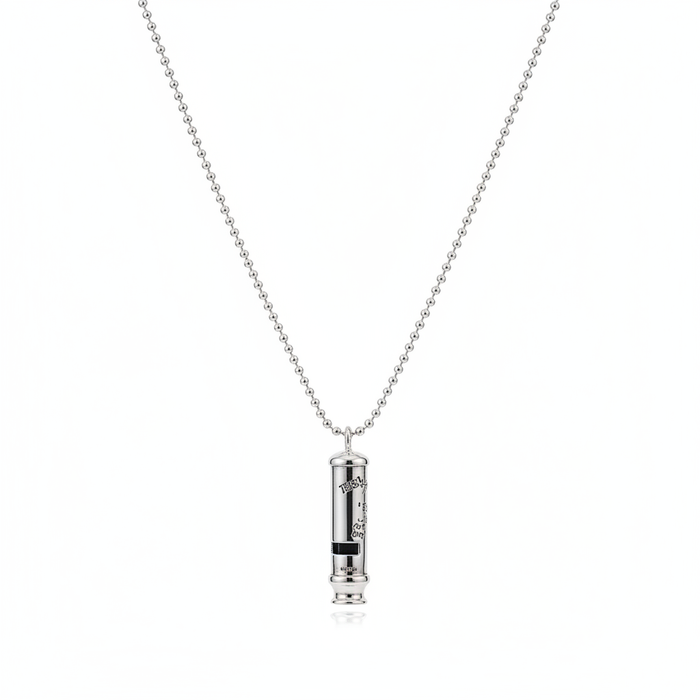 A high-shine, cylindrical silver-tone whistle pendant with engraved detailing, suspended from a classic ball chain necklace and shown against a clean white background.