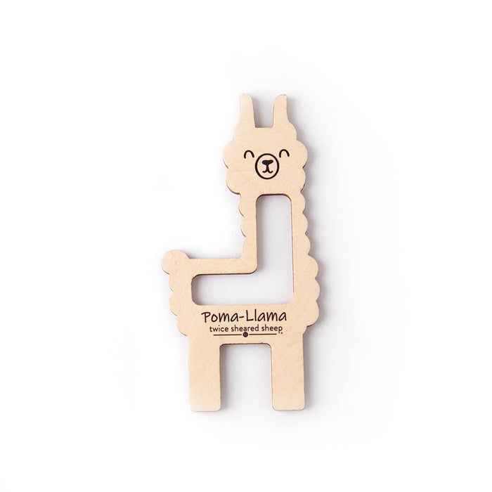 Poma-Llama pom pom and tassel maker by Twice Sheared Sheep, a laser-cut wooden llama-shaped tool shown on a white background
