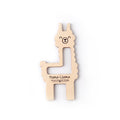 Poma-Llama pom pom and tassel maker by Twice Sheared Sheep, a laser-cut wooden llama-shaped tool shown on a white background
