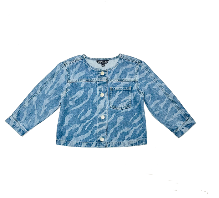 A light blue denim jacket for toddlers or kids, featuring a white zebra-like abstract pattern across the fabric, a button-up front, and a chest pocket, shown flat on a white background.