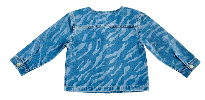 A light blue denim jacket with a white zebra-stripe pattern, shown from the back on a solid white background.