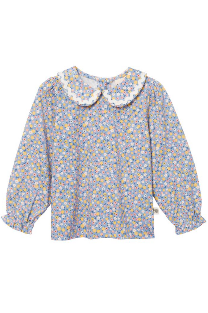 Floral blouse with a white collar on a white background