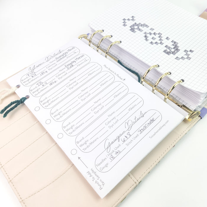 Yarn Details page and graph paper with hand-drawn knitting chart visible through gold ring binding inside the Spring Floral Project Journal Planner