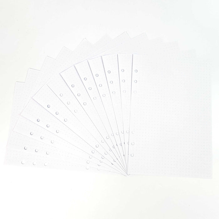 Fan of 24 white dot grid refill pages with hole-punched binding edge