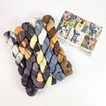 Five Pupper Patchwork mini yarn skeins with dog photo card showing the pups that inspired each color