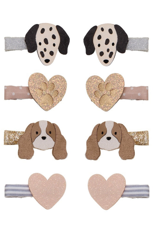 A set of eight baby hair clips arranged in a grid on a white background, featuring dog and heart designs in beige, brown, black, and gold glitter.