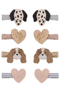 A set of eight baby hair clips arranged in a grid on a white background, featuring dog and heart designs in beige, brown, black, and gold glitter.