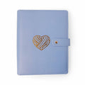 Purple Heart Project Journal Planner front cover in smooth periwinkle purple faux leather with a gold foil yarn heart design and snap closure
