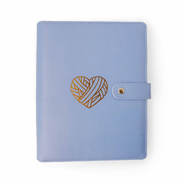 Purple Heart Project Journal Planner front cover in smooth periwinkle purple faux leather with a gold foil yarn heart design and snap closure