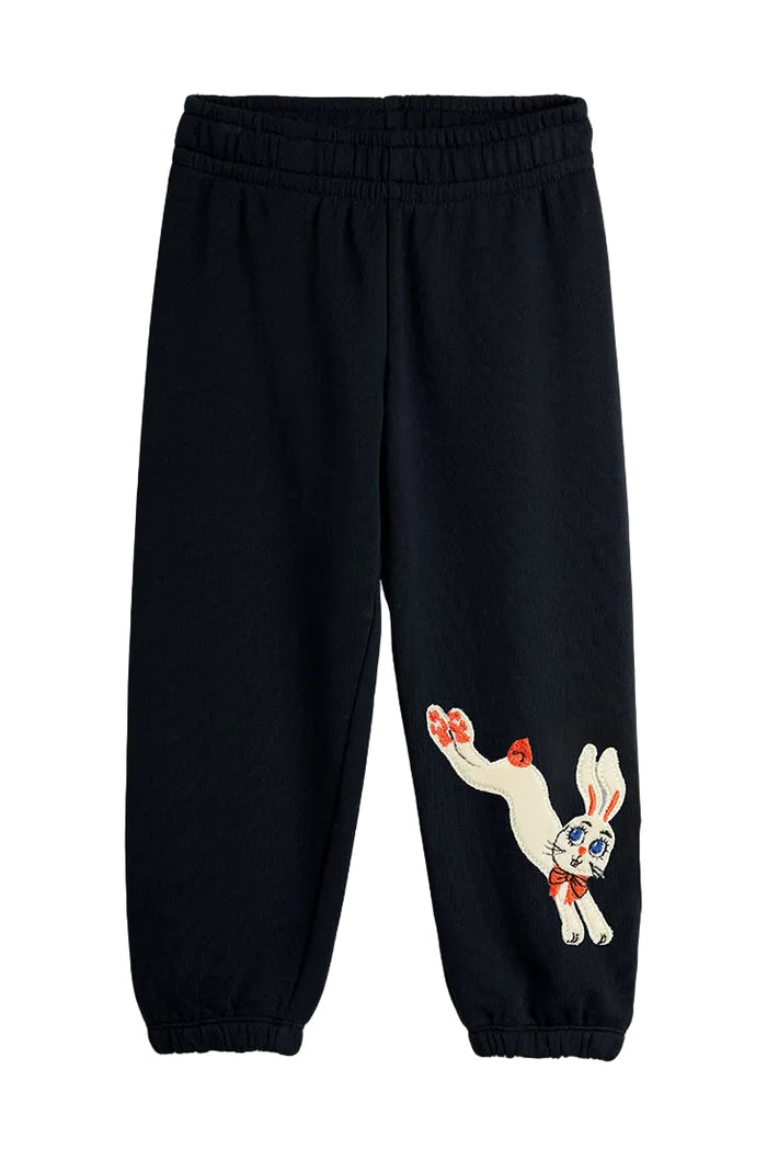 Black sweatpants with a rabbit design on a white background