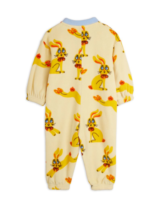 A baby's yellow-colored footless one-piece jumpsuit with an all-over cartoon rabbit print, shown from the back on a white background.