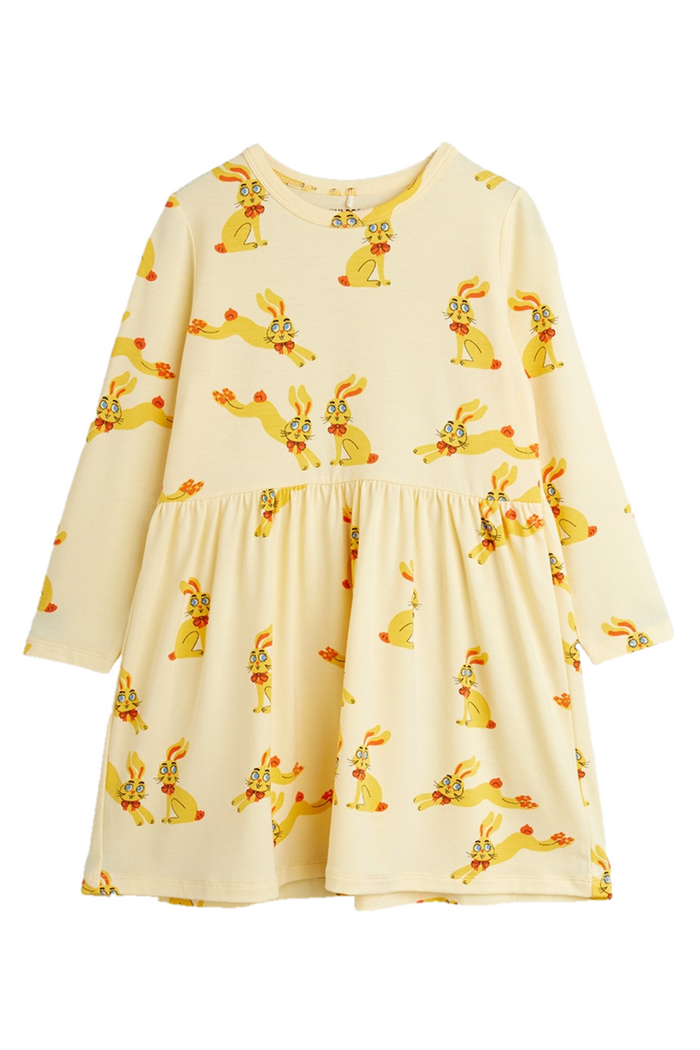 Yellow dress with rabbit print on a white background