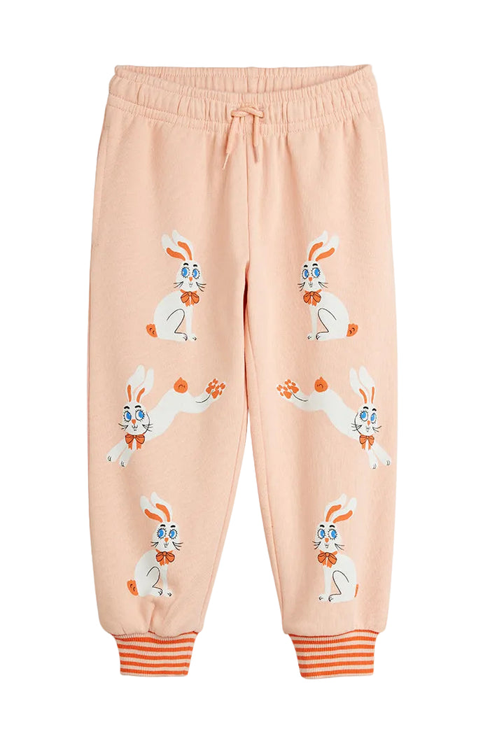 Pink sweatpants with cartoon bunny design on a white background