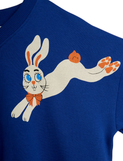 close up of bunny design on blue sweatshirt