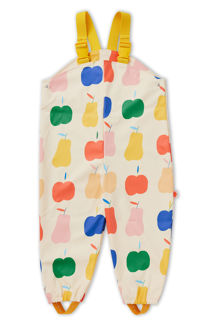Children's overalls with colorful apple pattern on a white background