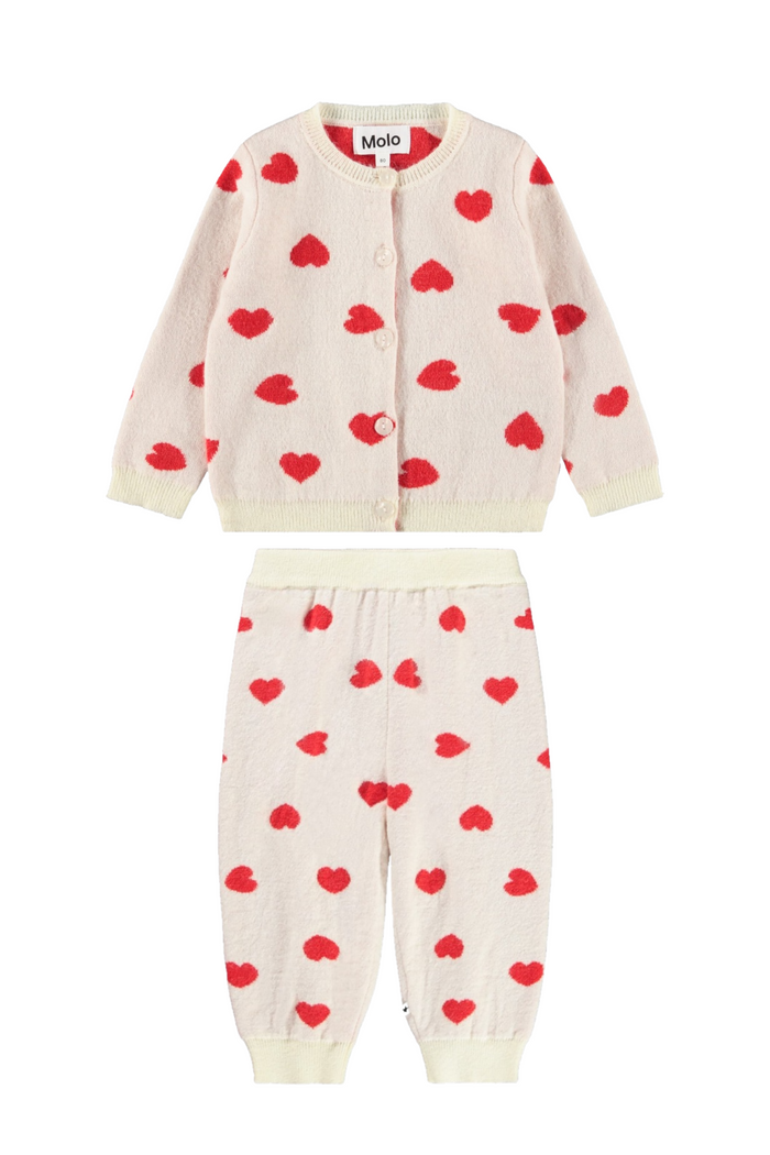Children's outfit with heart patterns on a white background