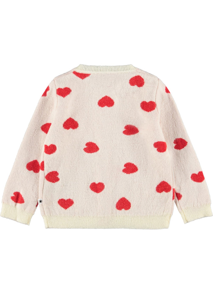 Cream-colored sweater with red heart patterns on a white background