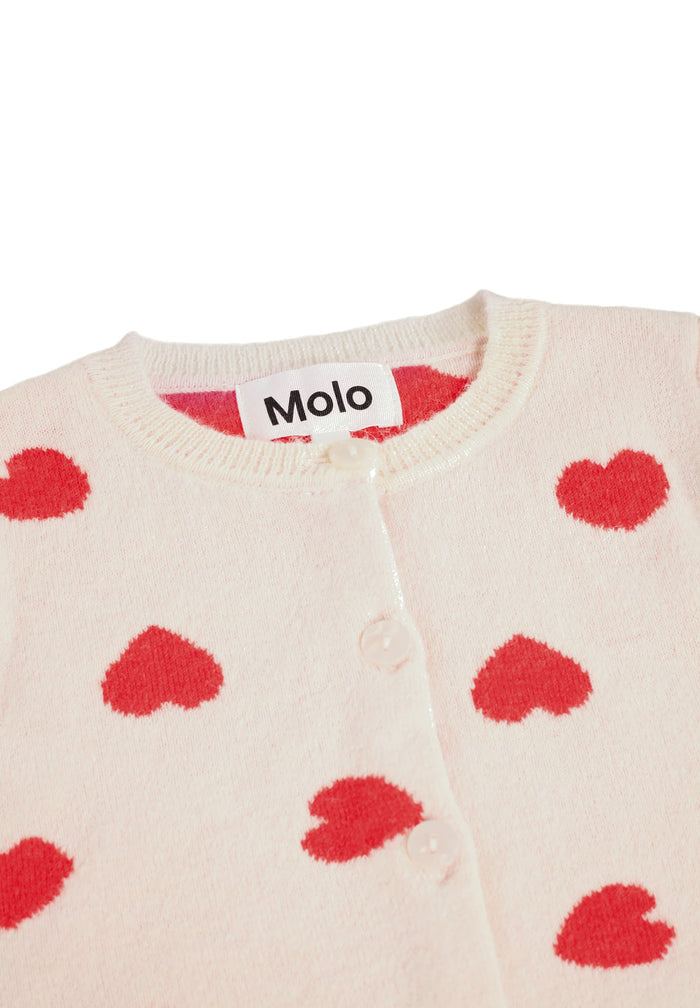 Beige sweater with red heart patterns and Molo label on a white background