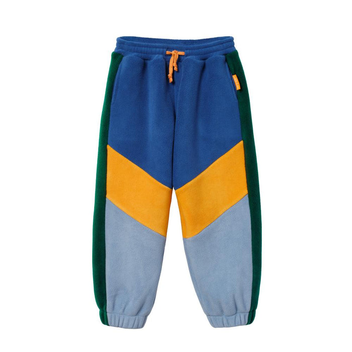 Color-blocked sweatpants with blue, yellow, and green sections on a white background