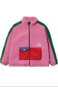 Pink fleece jacket with green sleeves and a red pocket on a white background