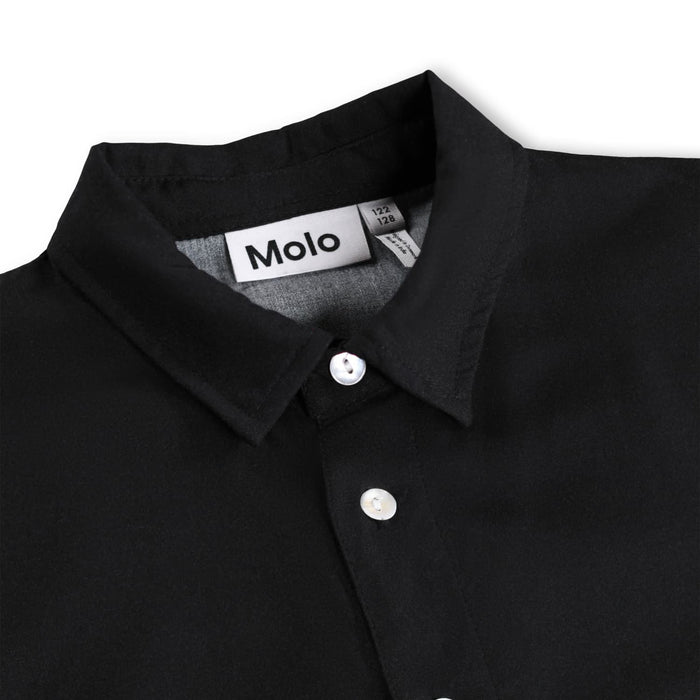 Black shirt with a visible brand label on a white background